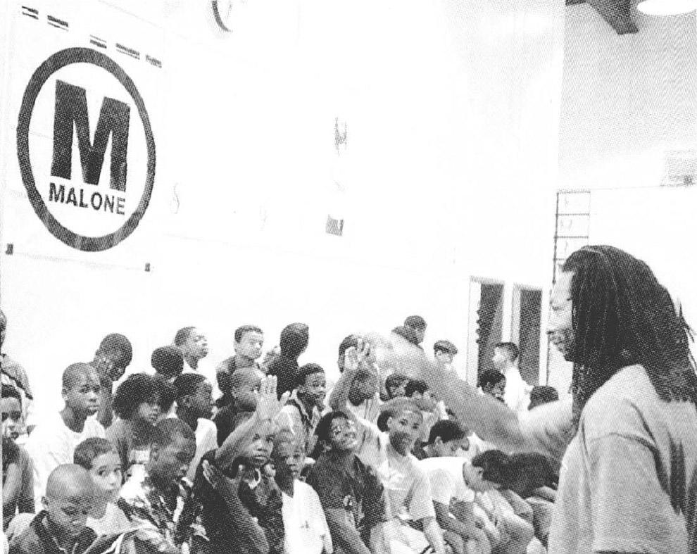 African American fashion designer Maurice Malone visits the Boys Club of Flushing, Queens New York in the 1990s.