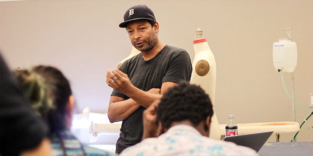 Designer Maurice Malone speaking to fashion students as guess speaker at Parsons School of Design