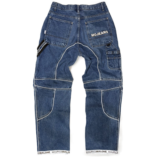 Rear view of 1999 Mojeans Blade Runner jeans showing reflective logo pocket, carpenter loops, cargo pockets, logo cuff hem, and 90s technical hip hop denim design.