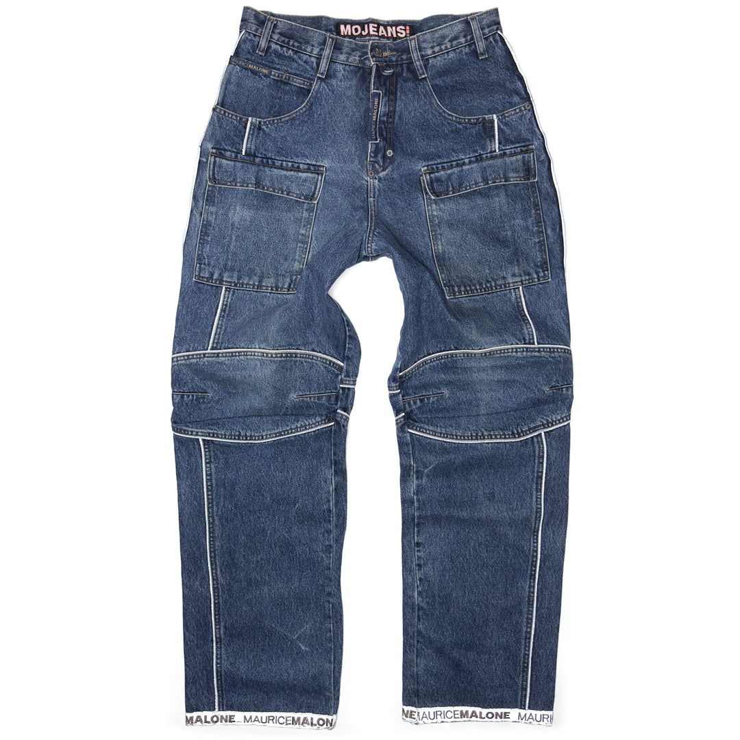 Front view of 1999 Mojeans Blade Runner jeans featuring cargo thigh pockets, reflective piping, logo cuff hem, and technical 90s hip hop denim styling.