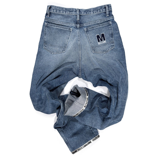 Rear view of Maurice Malone 1998-BR jeans showing tonal rear pocket logo, Logo Cuff hem, and recreated 90s baggy fit.