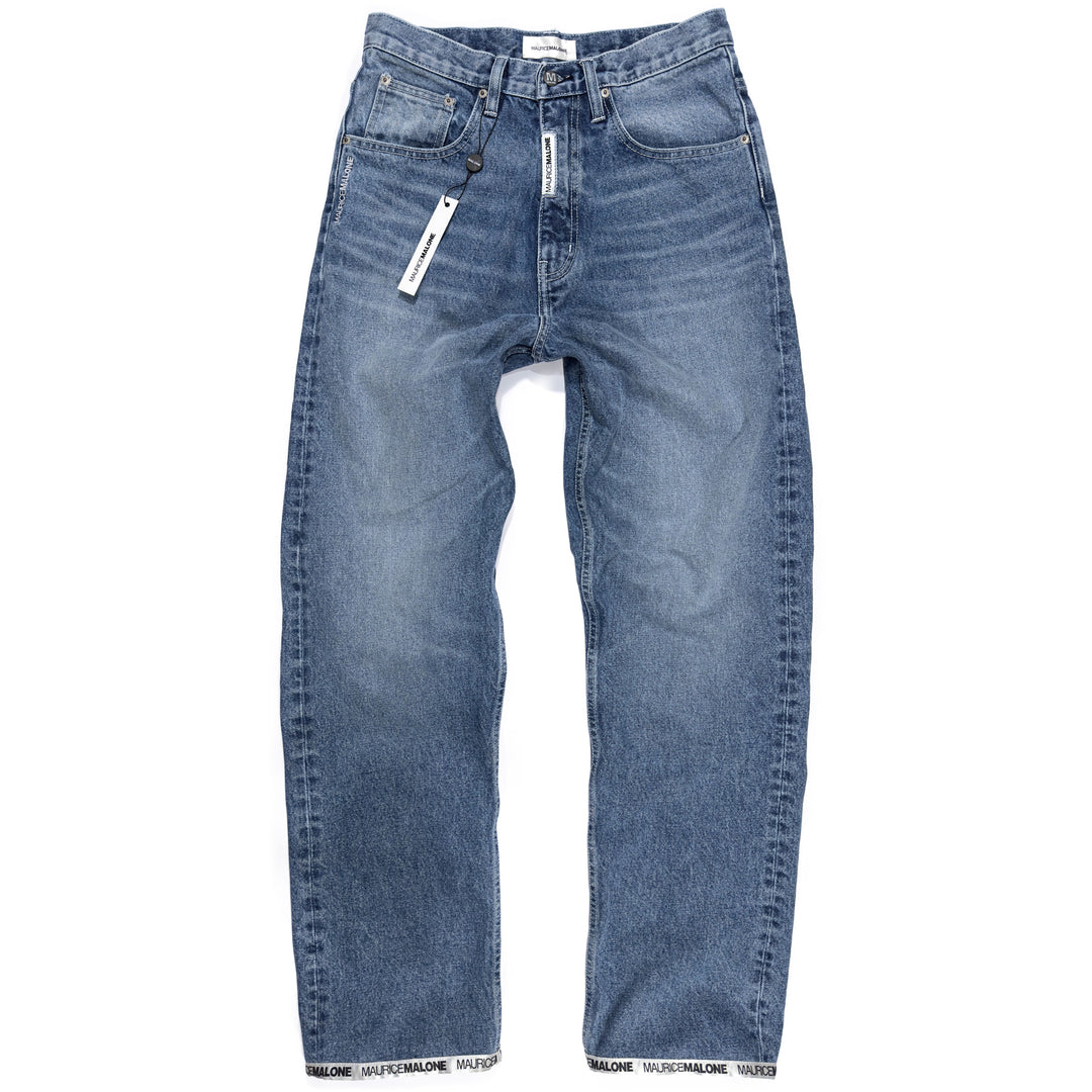 Front view of Maurice Malone 1998-BR jeans in light stonewash denim featuring a modern recreation of the brand’s iconic late-90s baggy fit with Logo Cuff hem.