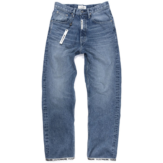 Front view of Maurice Malone 1998-BR jeans in light stonewash denim featuring a modern recreation of the brand’s iconic late-90s baggy fit with Logo Cuff hem.