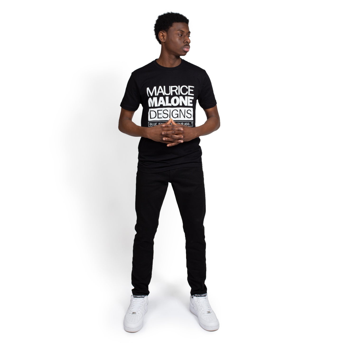 Maurice Malone black skinny jeans with logo hem branding & t-shirt worn by model Ottihh